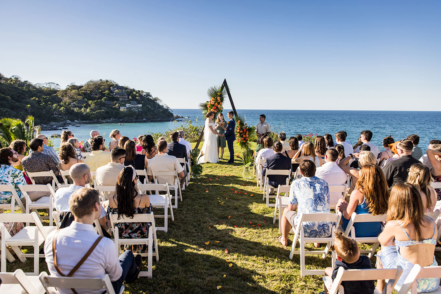 Wedding ceremony on a cliff near the ocean in Mexico