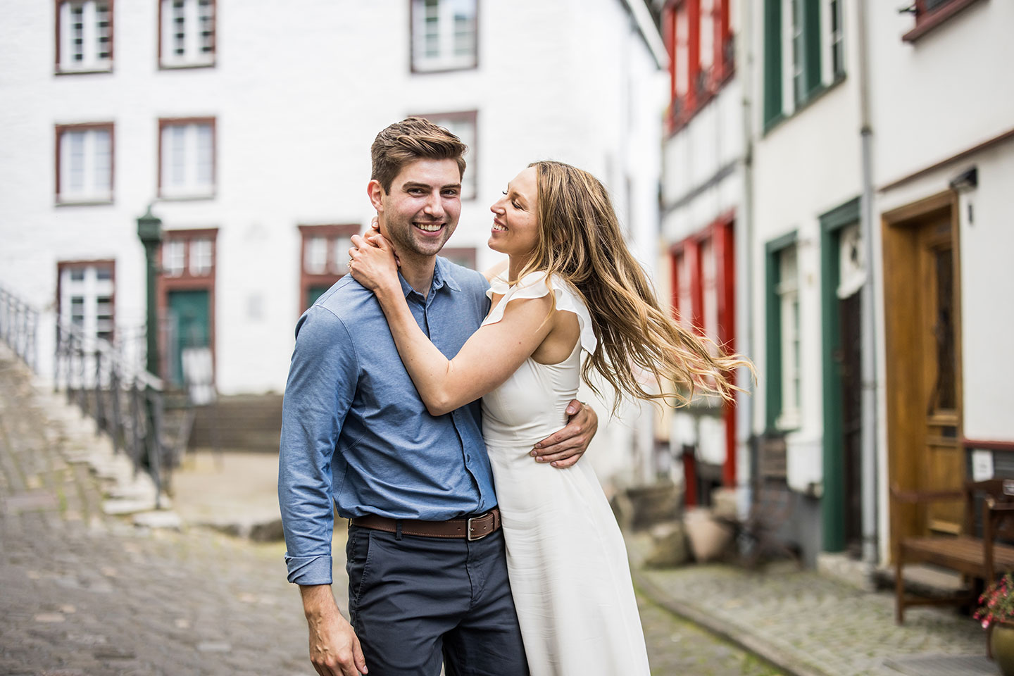 Young couple during their engagement shoot in Germany in the town of Monschau